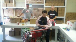 Volunteers receive milk and fresh food from The Salvation Army