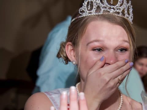 young woman being crowned dairy princess