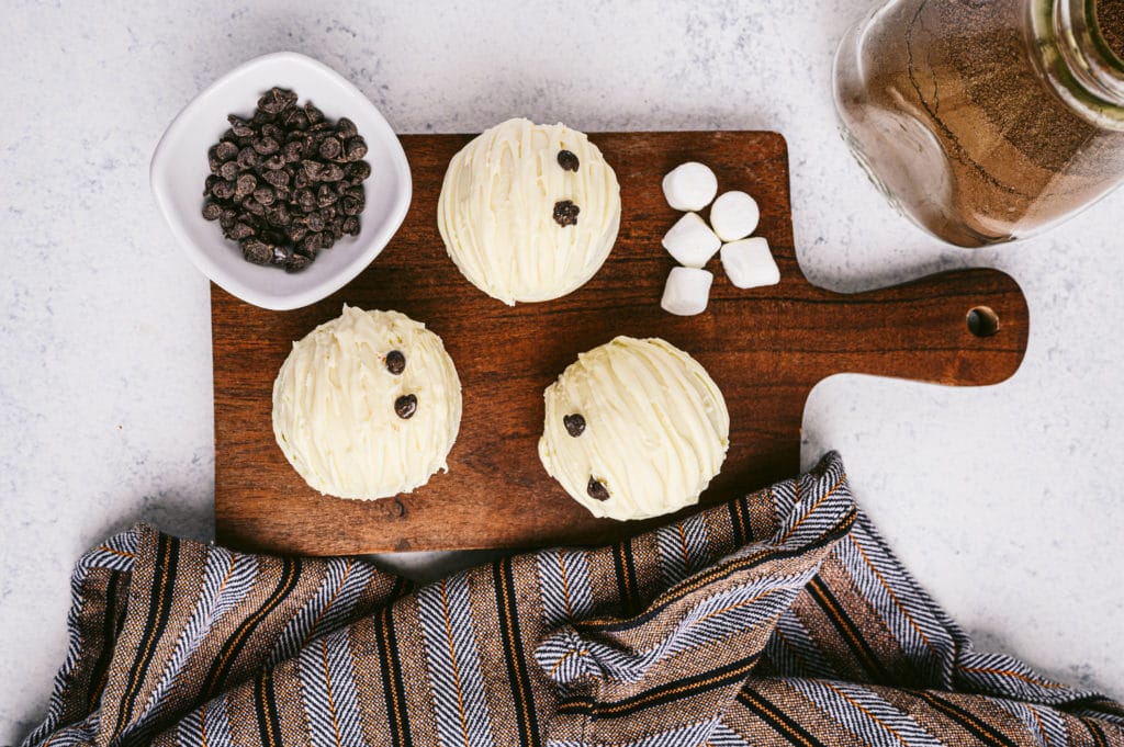 mummy hot cocoa bombs on a cutting board