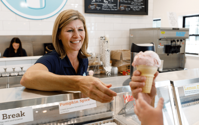 woman serving an ice cream cone