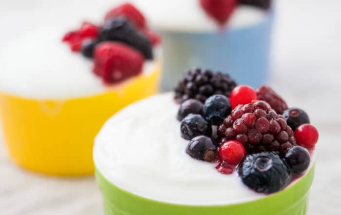 ramekins with yogurt and berries on top for sustainable nutrition