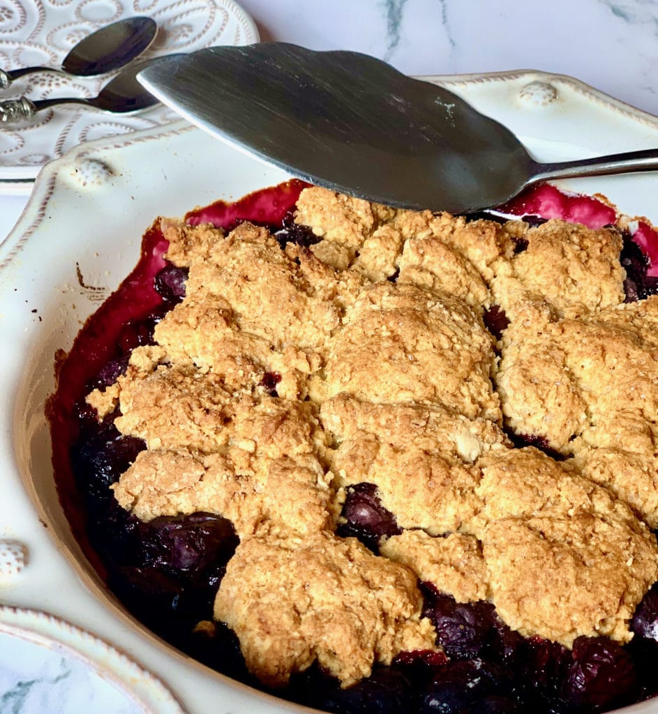 Cherry cobbler with spoon