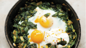 Kale chili eggs in a pan