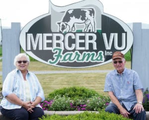 Old couple sitting in front of Mercer Vu sign