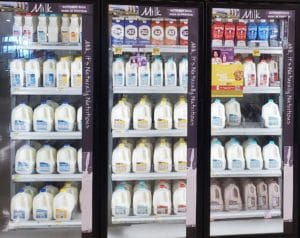Refrigerators of milk at a grocery store