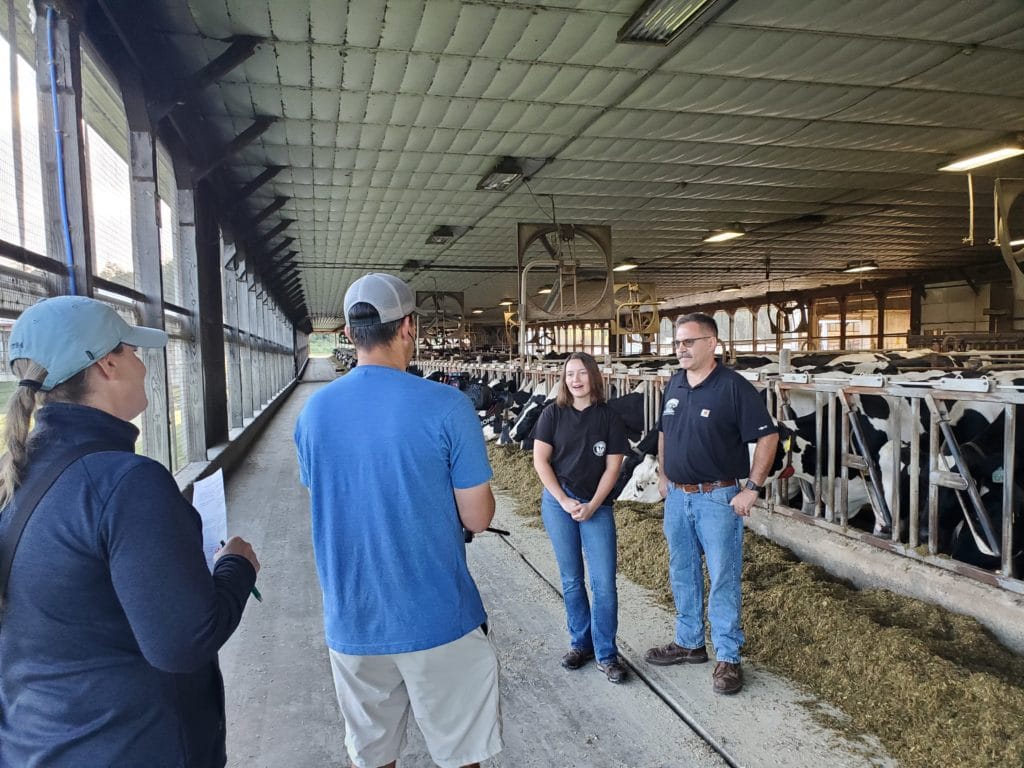 people on camera at a dairy farm