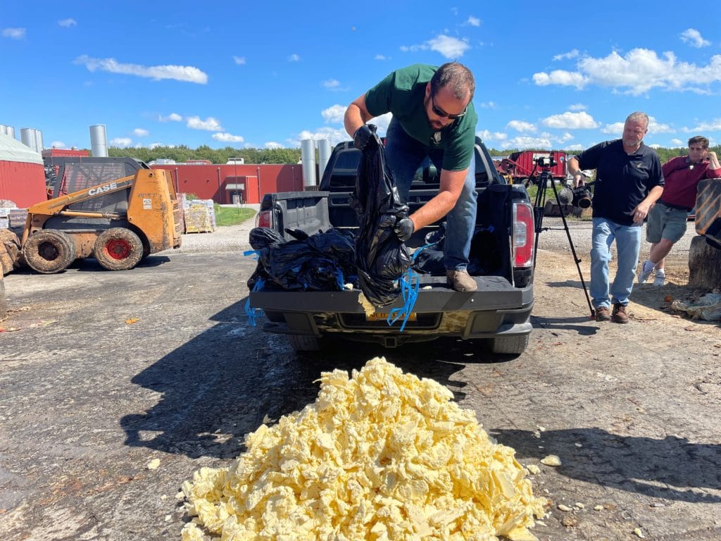 person unloading scrap butter
