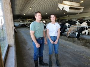 2 farmers in a barn