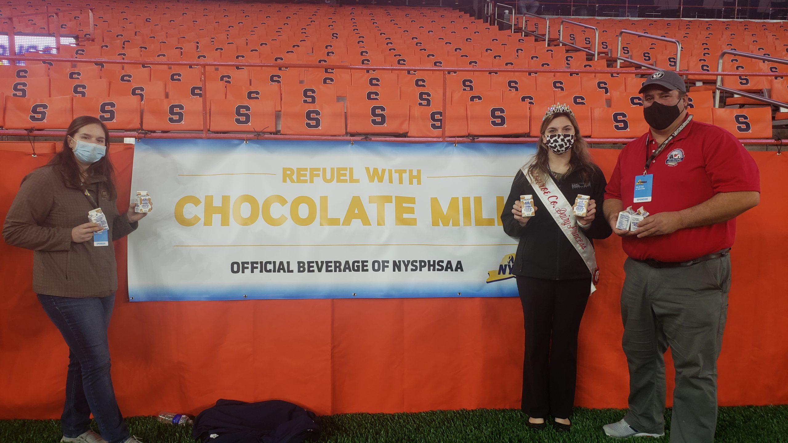 Dairy Princess posing at a stadium