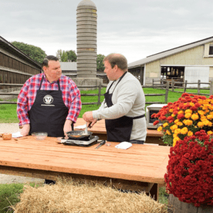 Farmer Nate and chef Anthony Contrino showcasing culinary skills in celebration to National Farmers Day.