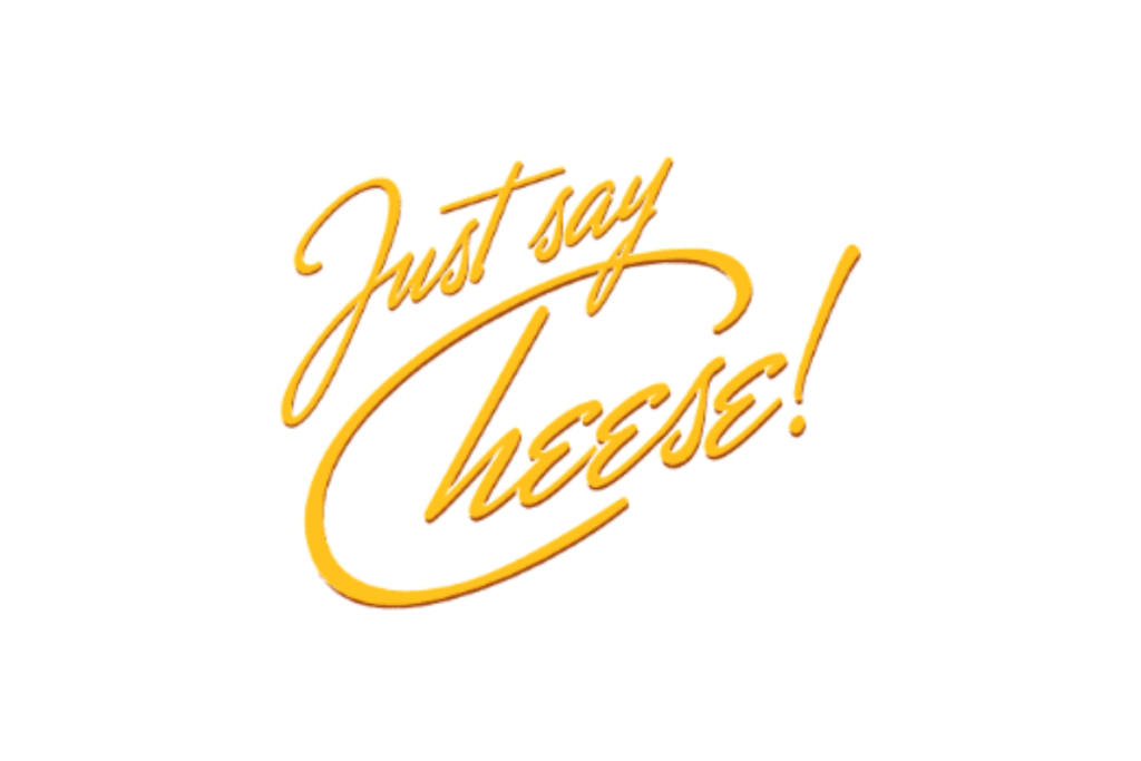 The "Just say cheese!" logo with script typography in yellow.