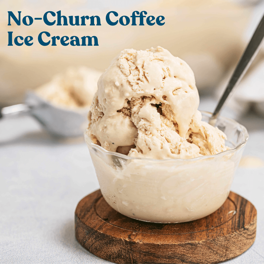 A crystal bowl of no-churn coffee ice cream served with a silver spoon on a wooden coaster