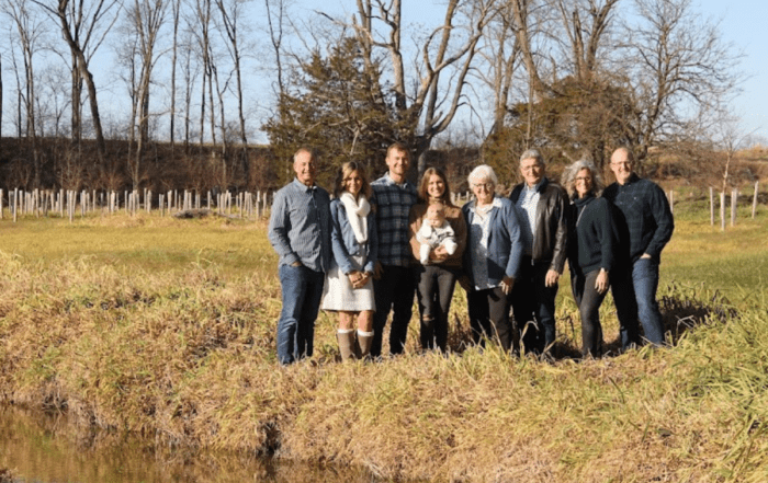 A family of dairy farmers who have a commitment to sustainable agriculture enjoying a day on a farm.