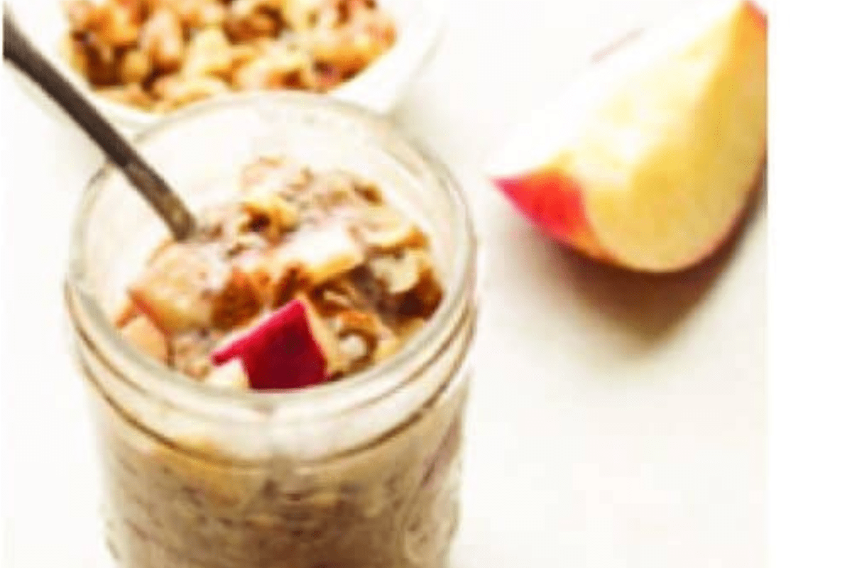 A jar filled with apple cobbler overnight oats.